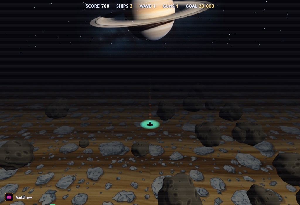 Ring Runner gameplay — a top-down view of a gunship flying over the golden banded rings of Saturn, blasting ice and rock debris, with Saturn glowing on the horizon.